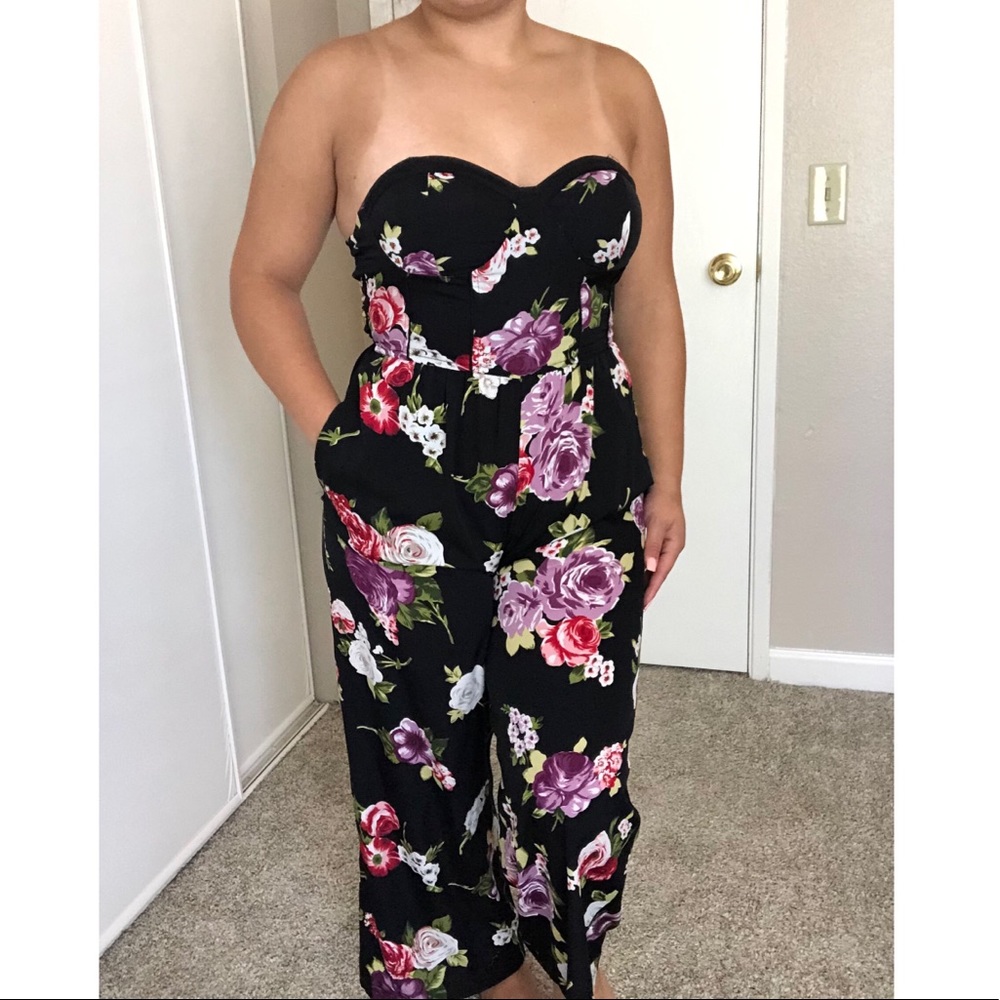 Black jumpsuit with a very pleasant floral design.